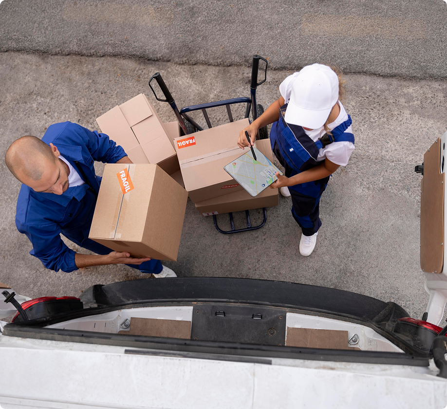 Professional full service movers in Portland and Vancouver loading fragile boxes into a truck for a residential relocation.
